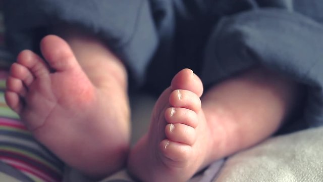 New Born Baby Boy Feet Close Up