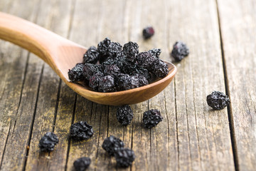 Dried chokeberries. Black aronia berries.
