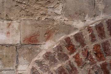 fragment of an ancient masonry and part of a brick arch