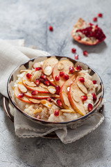 Coconut rice with pomegranate, pear and almond slices