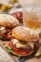 Two cheeseburgers on sesame buns