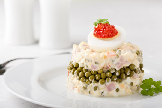 Russian Olivier salad with red caviar on top