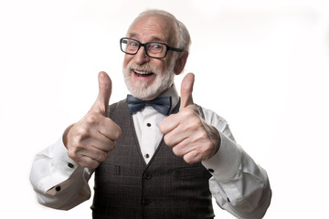 Super. Waist up portrait of bearded elderly man giving his thumbs up and laughing. Isolated on...