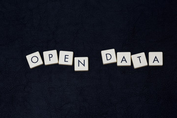 Obraz premium Open data text on a black leather surface. 