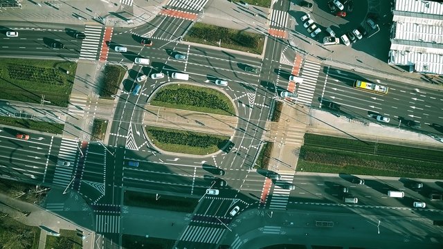 Aerial top down view of road traffic on big intersection