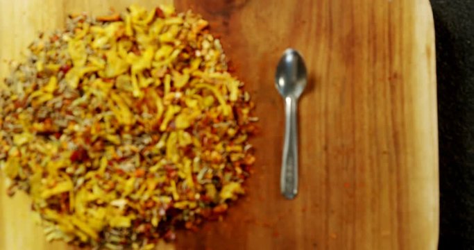 Mix spices with spoon wooden board 