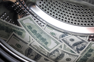 One hundred dollar bills in a washing machine, money laundering.