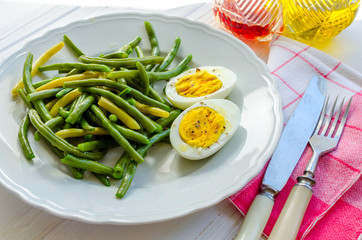 Fototapeta na wymiar Cooked green beans with boiled eggs