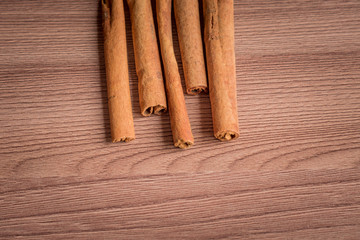 cinnamon sticks on wooden table.