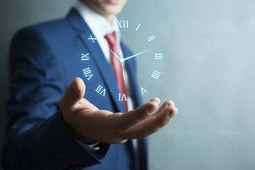 Businessman hand pushing time icon on virtual screen