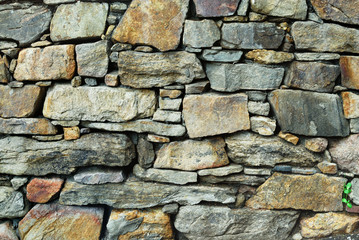 Detail of stone wall with small stone infill.