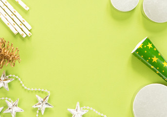 Christmas background. Christmas stuff on green background. Flat lay, top view