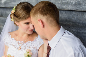 Young wedding couple enjoying romantic moments outside on a summer day