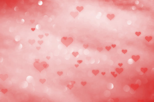 Red colored hearts on blurry bokeh reflection background. 