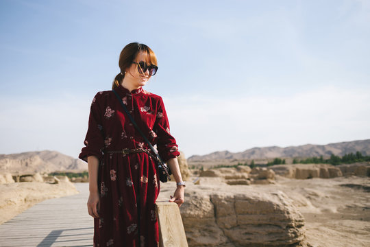 young lady  in site of an ancient city