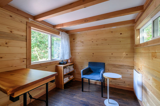 Interior design of a cozy living room in a rustic log cabin.