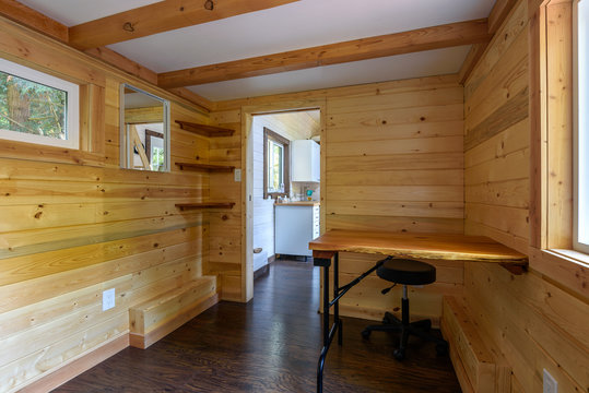 Interior design of a cozy living room in a rustic log cabin.