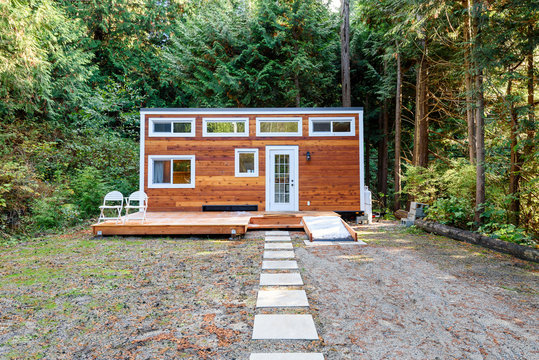Small wooden cabin house. Exterior design.