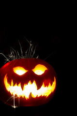 Halloween Pumpkin with Scary Face and Sparks 