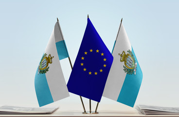 Two flags of San Marino and European Union flag between