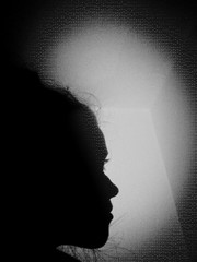 suspicious silhouette of a woman with darknet hacker code