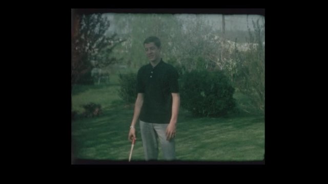 1966 Brothers playing Badmitton in backyard