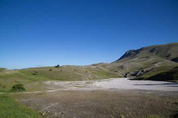 Fototapeta na wymiar Cima di Monte Bolza, north flank, dry riverbed meltwater
