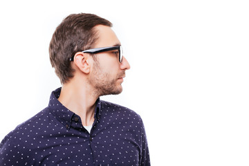 Side view of young bearded man isolated on white background