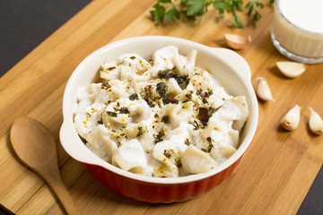 Traditional turkish ravioli with garlic