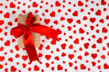 Valentine's Day. Presented as a red ribbon on a white paper with red hearts