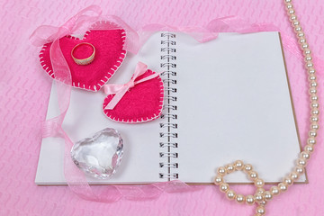 Valentines day hearts and notepad for your text. Top view on wooden table