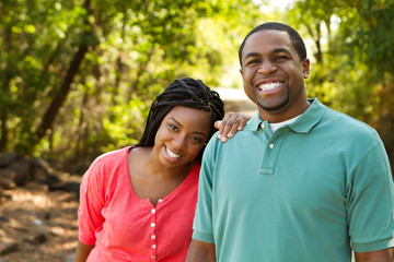 Obraz premium Beautiful happy couple smiling outside.