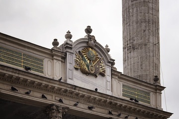 Close up view of Tesvikiye mosque. It is a neo-baroque structure in Nisantasi neighborhood of Istanbul. Texts from Quran and Ottoman Empire's emblem are on facade.