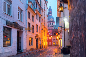 Fototapeta premium Typical europeen medieval street and the Cathedral of Saint Mary in the morning, Riga, Latvia