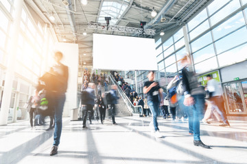 blurred people in a modern hall