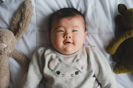 Playful baby looking at camera