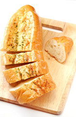 Garlic bread on wooden board     