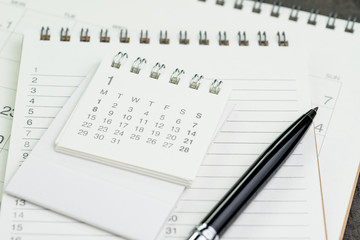 Calendar planner page on notebook list with a pen using as reminder or year plan appointment