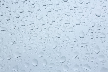 Water drops pattern background / Moisture droplets on glass texture