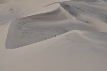 Climbing the sand dunes in Death Valley