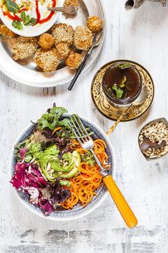 Colorful salad with millet balls