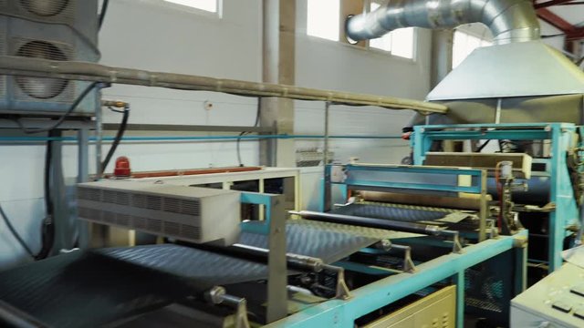The production of the geogrid in the machine in the plant.