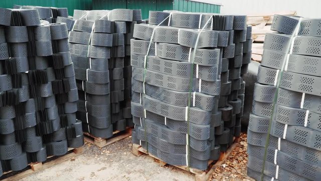 Stacks of geogrid on pallets on the stock of the plant.