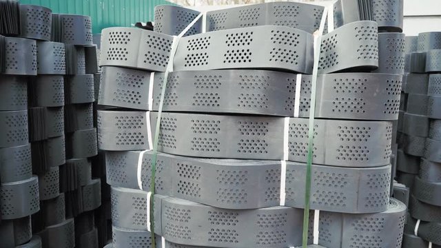 Stacks of geogrid on pallets on the stock of the plant.