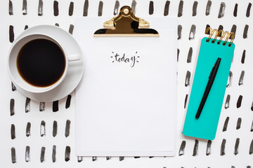 desk space with message on a clipboard declaring today"""esk sp"