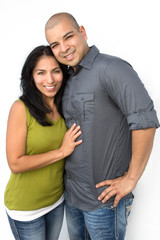 Young Hispanic couple smiling.