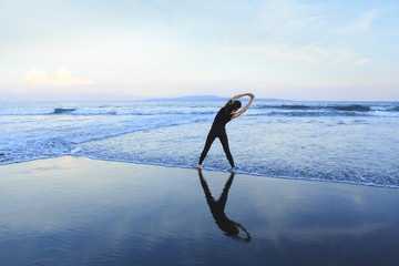 Asian woman running  at a beach