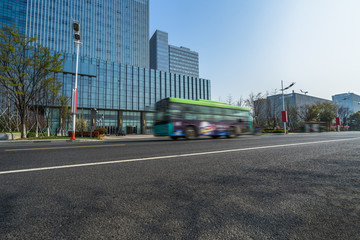 Fototapeta na wymiar city empty traffic road with cityscape in background