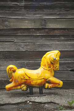 Retro vintage old children's toy in laneway
