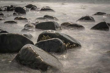 Rocky Stones in Blurred Water by Long Exposure